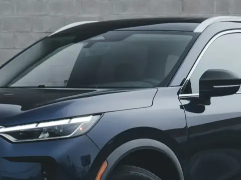 Front and front passenger side view of a vehicle with tinted windows